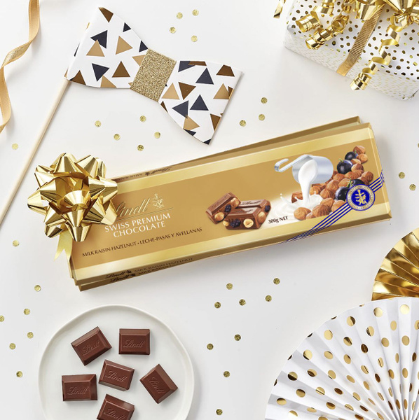 Шоколад Lindt молочный Gold с изюмом и орехами 300г, Швейцария - купить ...
