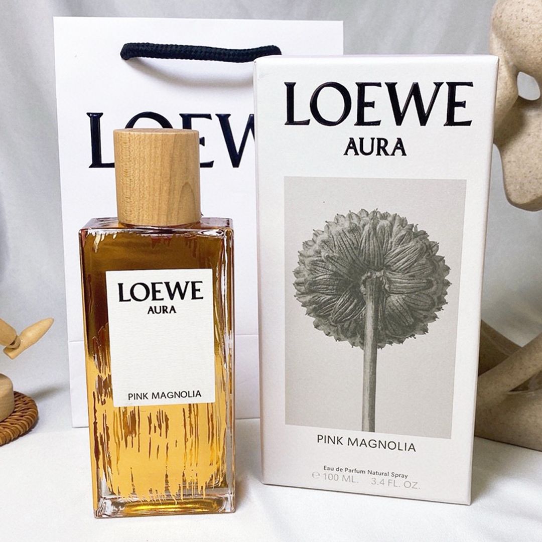 Духи loewe aura floral. Loewe aura. Loewe духи оранжевые. Духи loewe aura pink magnolia. Loewe aura pink.