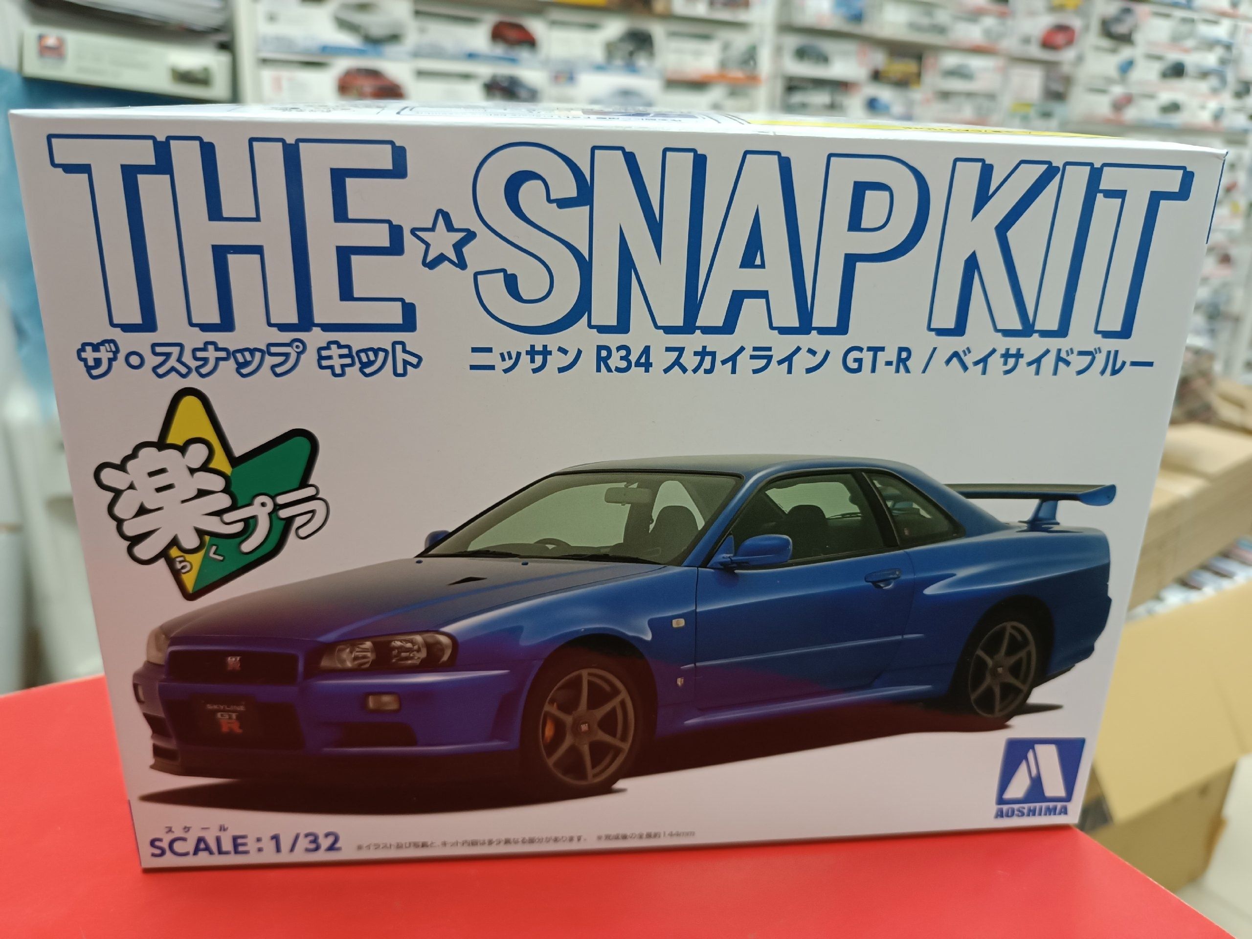 Сборная модель Aoshima 1:32 06250 Nissan Skyline GT-R R34 (Bayside Blue) сборка без клея