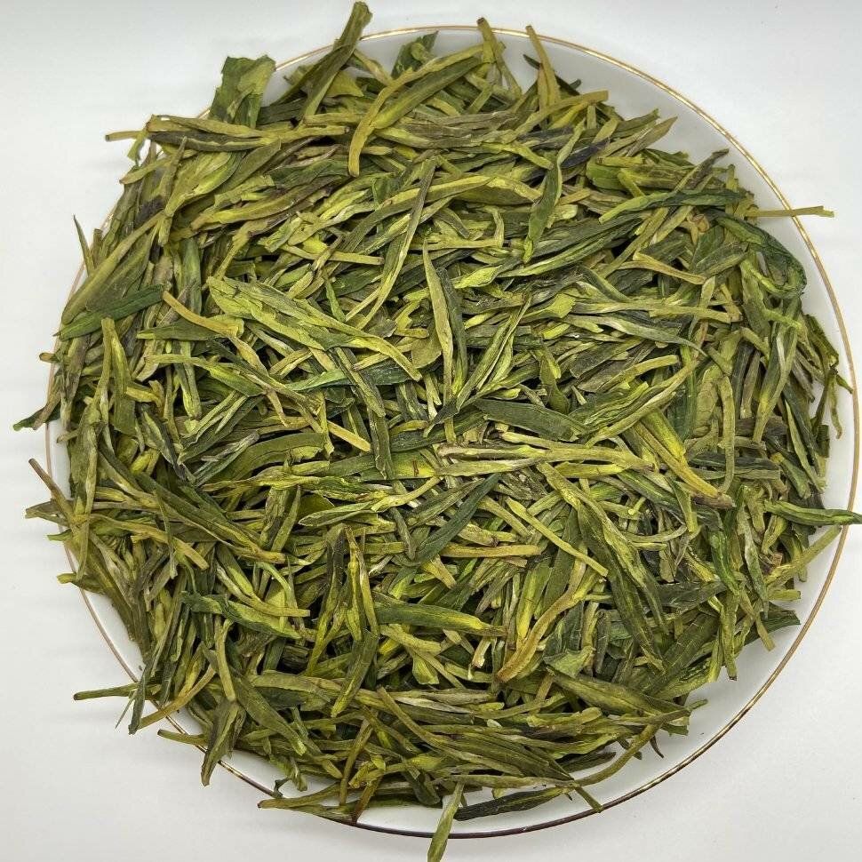 Китайский зеленый чай. Лунцзин колодец дракона. Сиху Лунцзин (колодец дракона). Зеленый чай Лунцзин колодец дракона. Сиху Лунцзин чай.