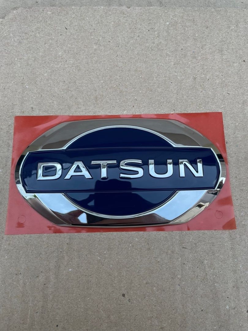 Колпачки датсун. 628904la0a. Деталь Datsun арт. 152085pa0b. Датсун эмблема. 908905pa0a.