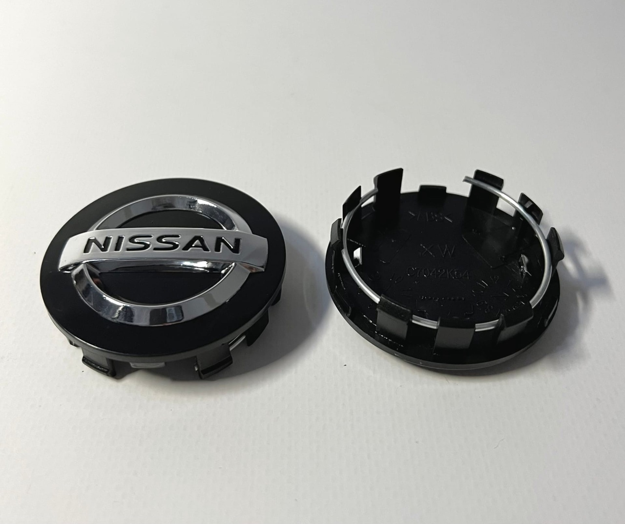 Колпачки заглушки ниссан. Заглушка литого диска ниссан альмера g16. Заглушка на литой диск ниссан х-трейл. Колпачки заглушки на литые диски для nissan. Колпачок ступицы колеса nissan x trail t30.