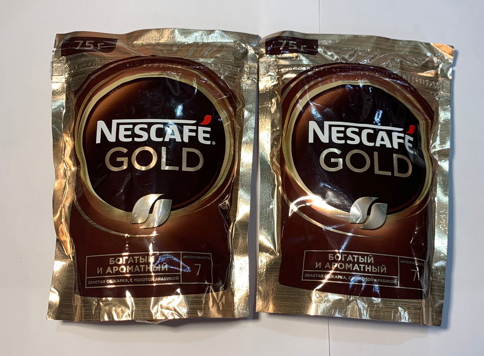 Nescafe gold intenso. Nescafe Gold 75г. Nescafe Gold пакет. Кофе Нескафе Голд в пакетиках. Нескафе Голд растворимый 75 г.