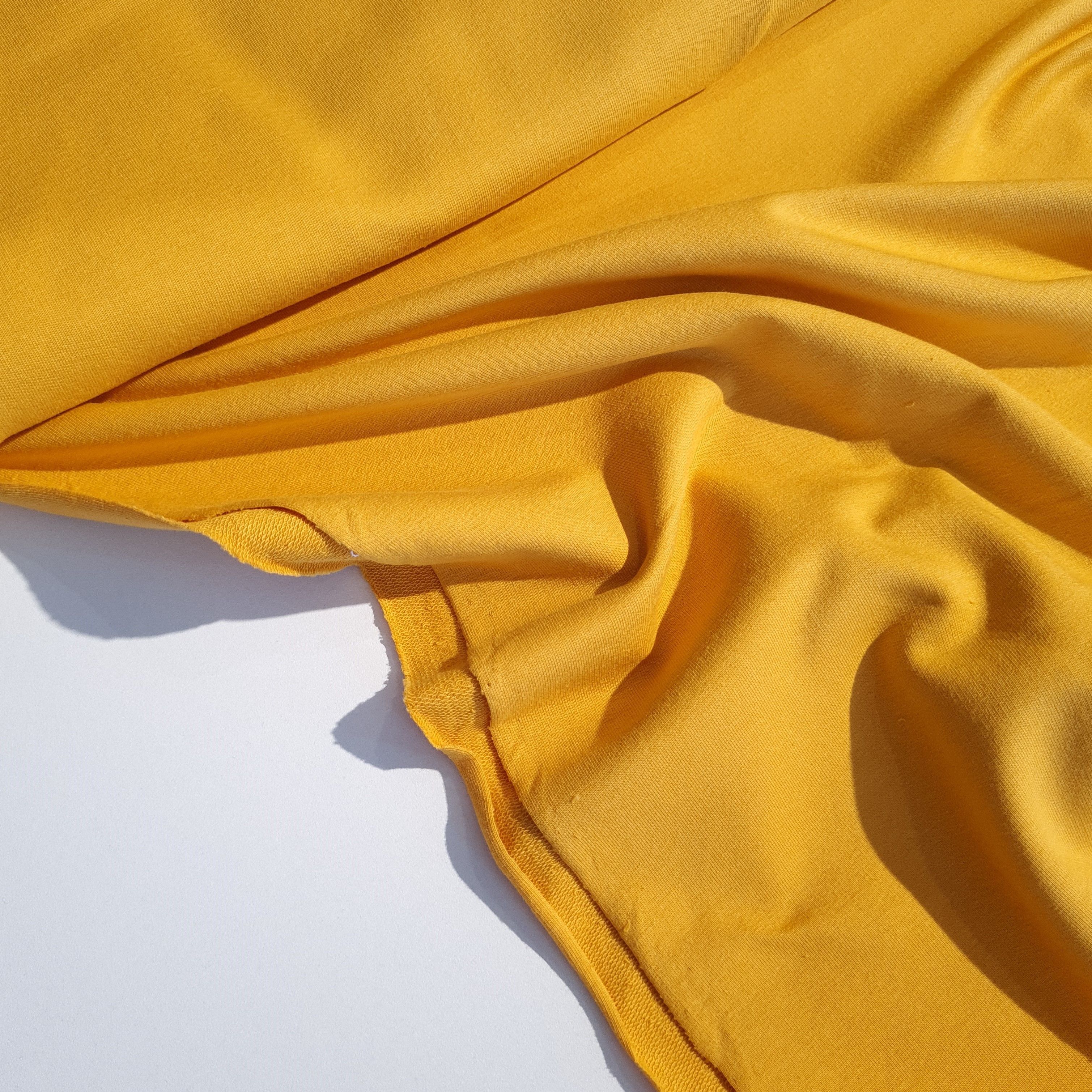 Пенье ткань. Желтая хб материя. Футер желтый. Цвет ткани желтый футер.