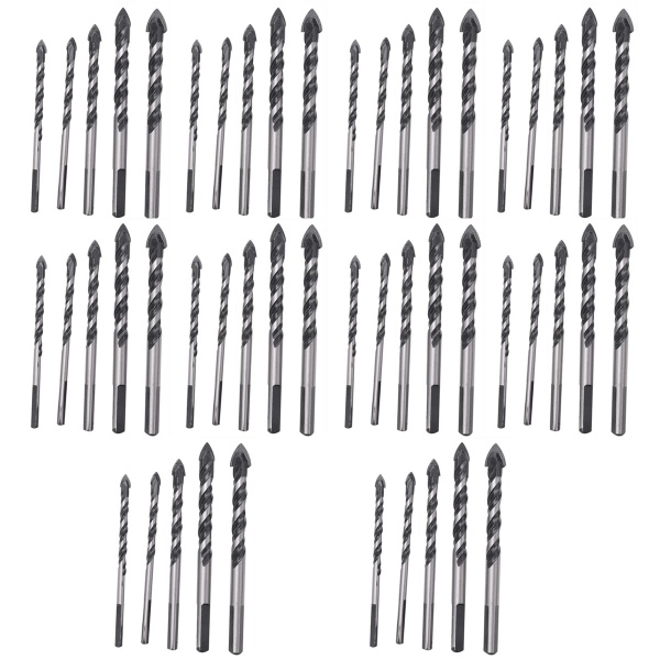 разные виды сверл по бетону и кирпичу на деревянном столе