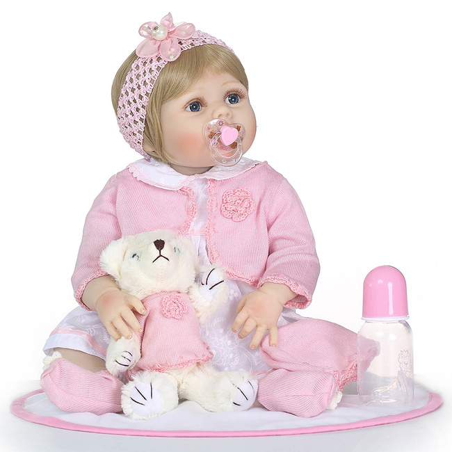 baby girl with doll