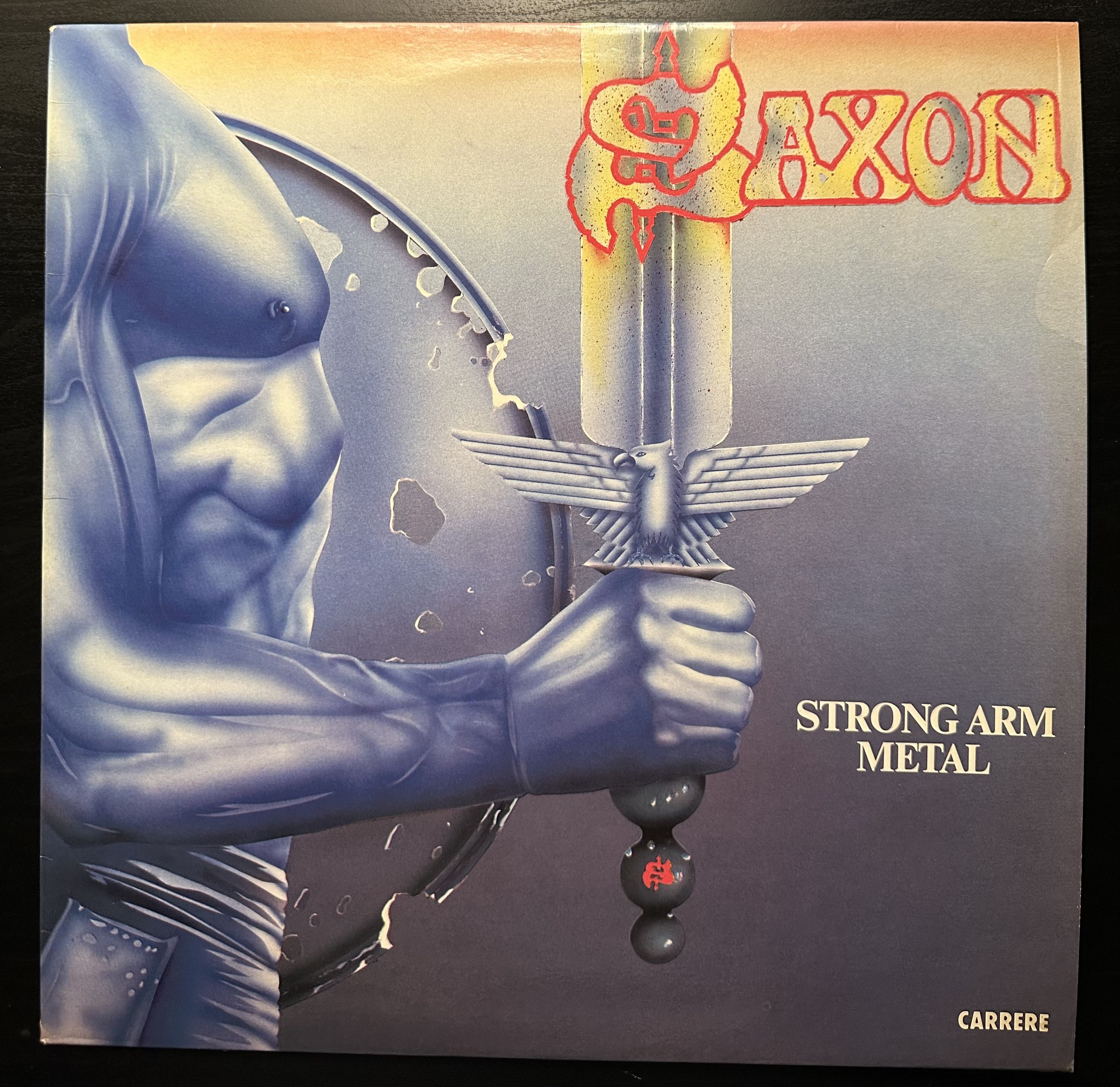 Lp metal. Saxon strong Arm Metal. Saxon дискография. Обложки альбомов Saxon. Saxon Metalhead обложка альбома